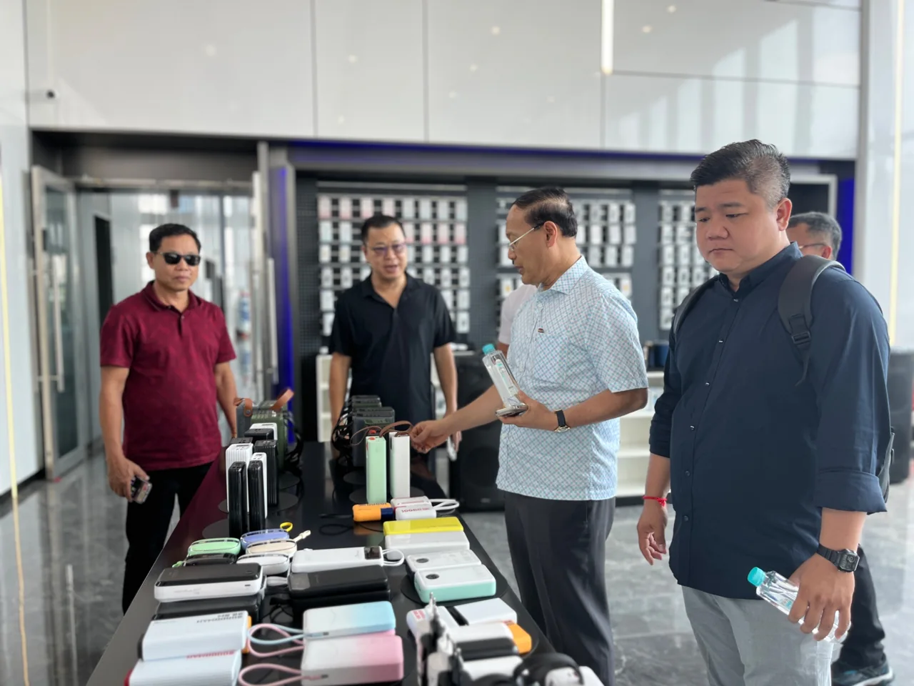 Visitors discussing products in a showroom