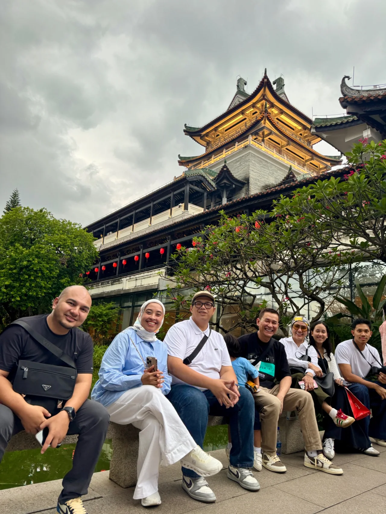A group in front of traditional temple architecture